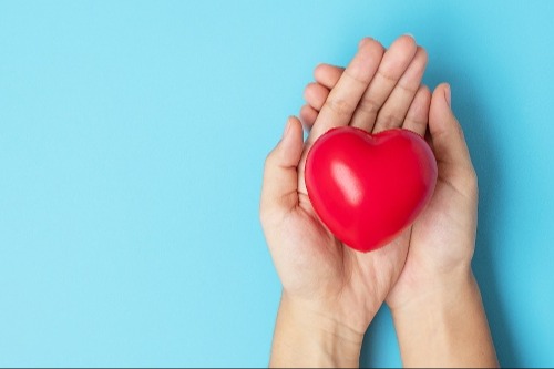woman-holding-red-heart-shape-life-insurance-don-2022-11-07-22-12-17-utc-1